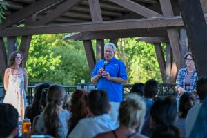 Person speaking at picnic