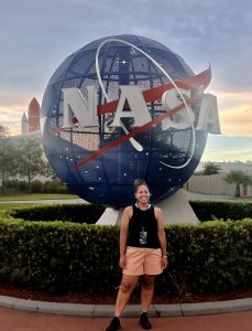 Sahler in front of NASA sign