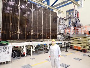 Zahler in front of solar array